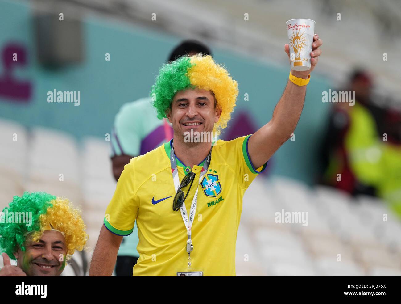 A fan of Brazil drinking a nonalcoholic Budweiser Zero beer, in the