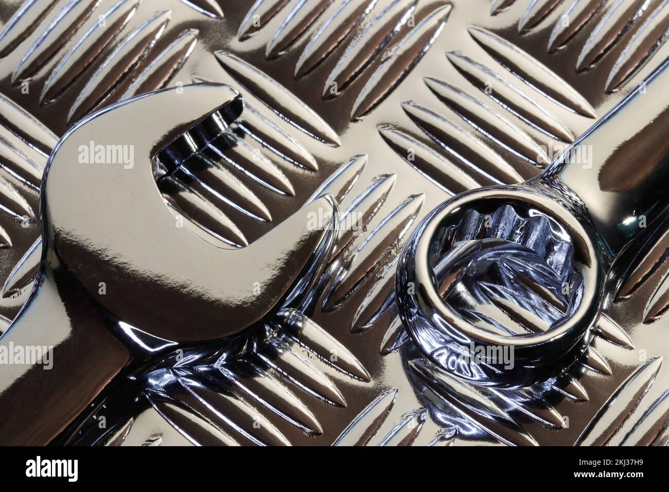 Chrome Spanner Heads On Metal Tread Plate Stock Photo - Alamy