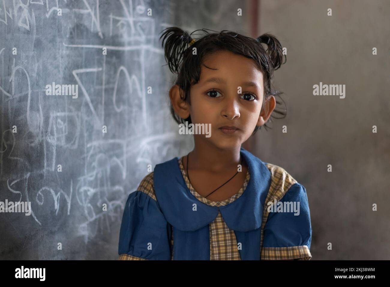 portrait of a school girl sitting in classroom Stock Photo - Alamy