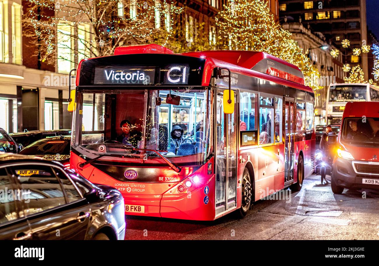 A London Bus At Night in Chelsea London UK Stock Photo