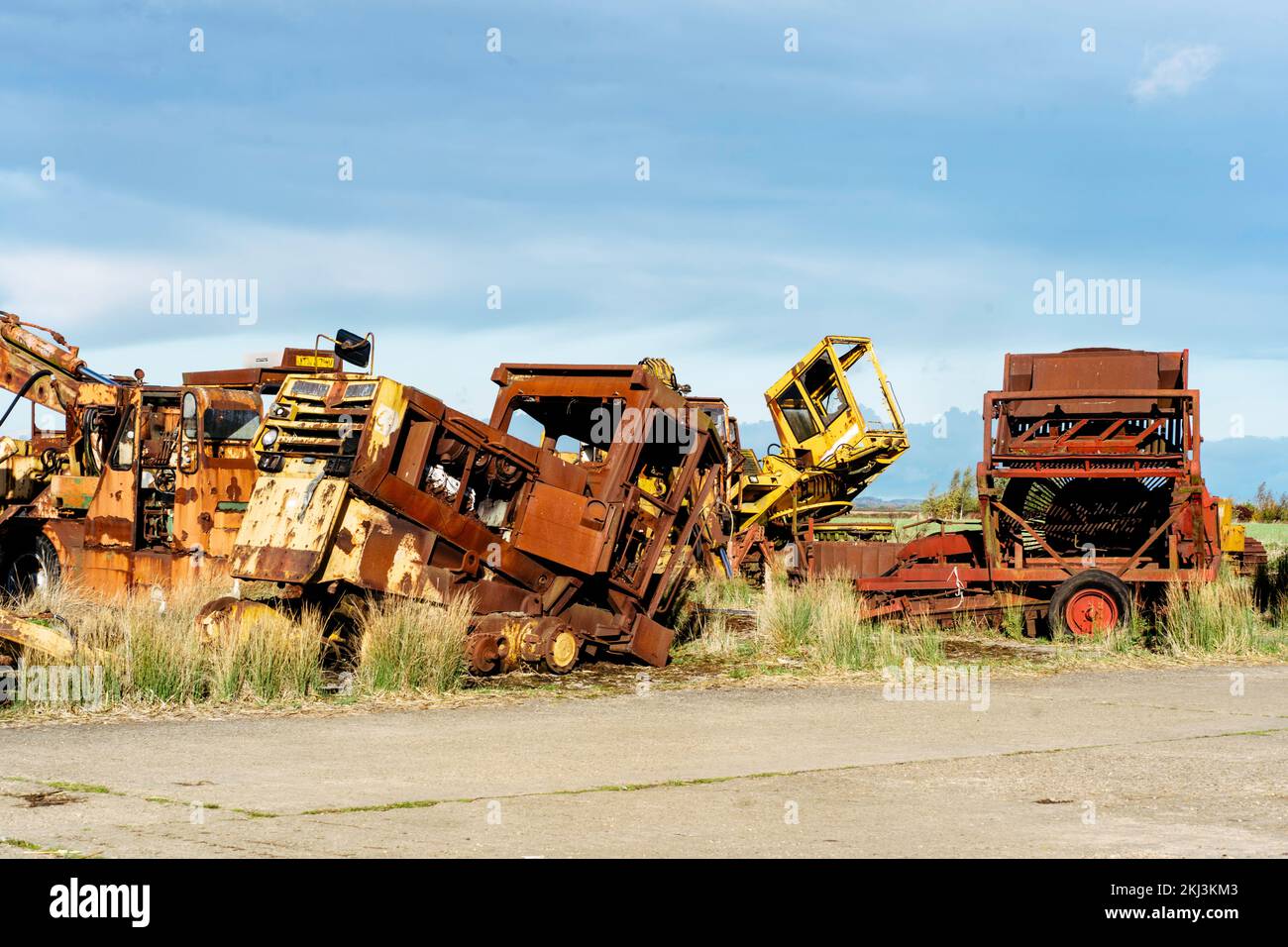 Junk yard full of old farm equipment Stock Photo Alamy