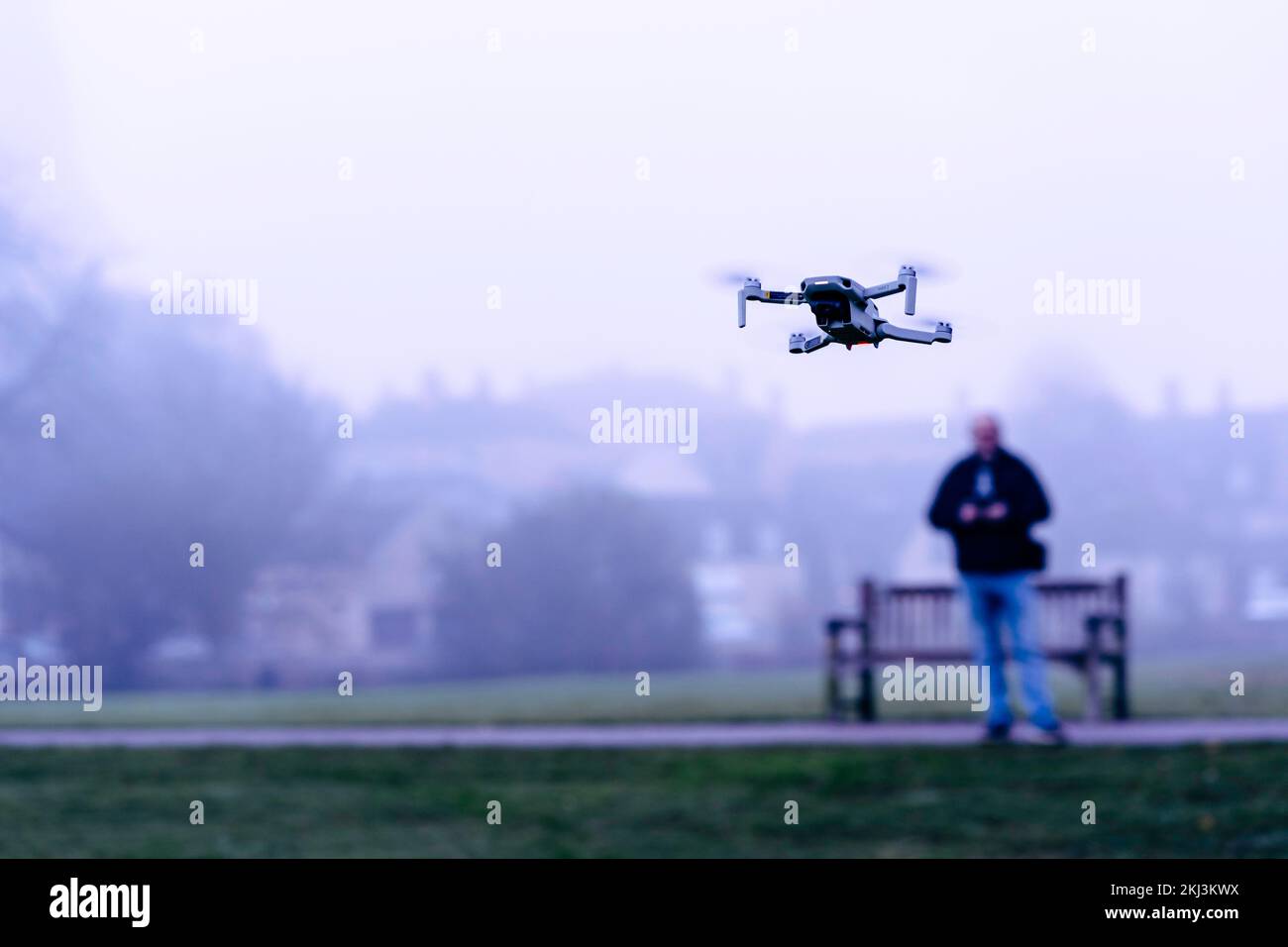 Man flying a drone in the park Stock Photo