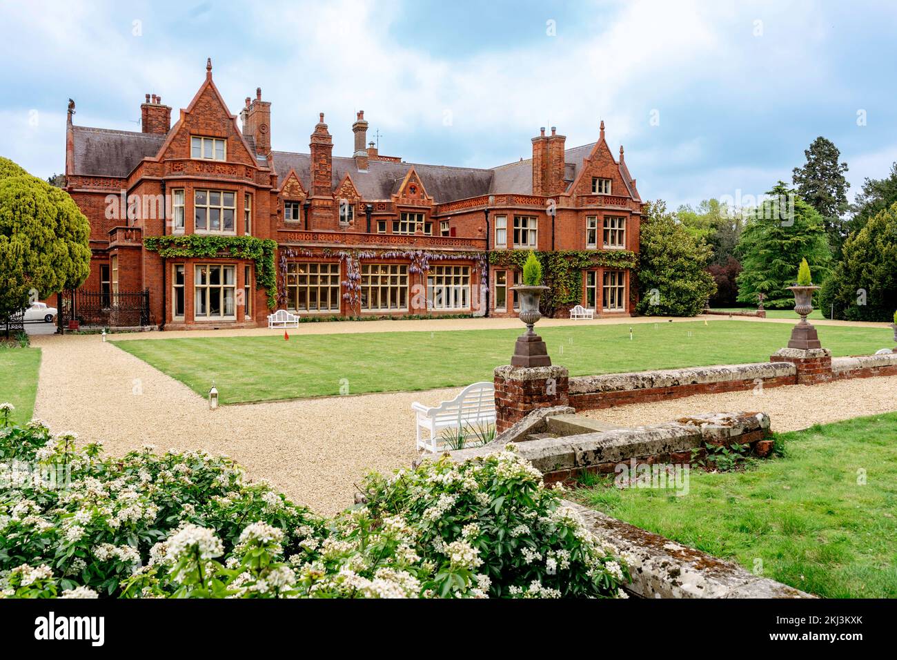 Large English manor house with landscaped lawn Stock Photo
