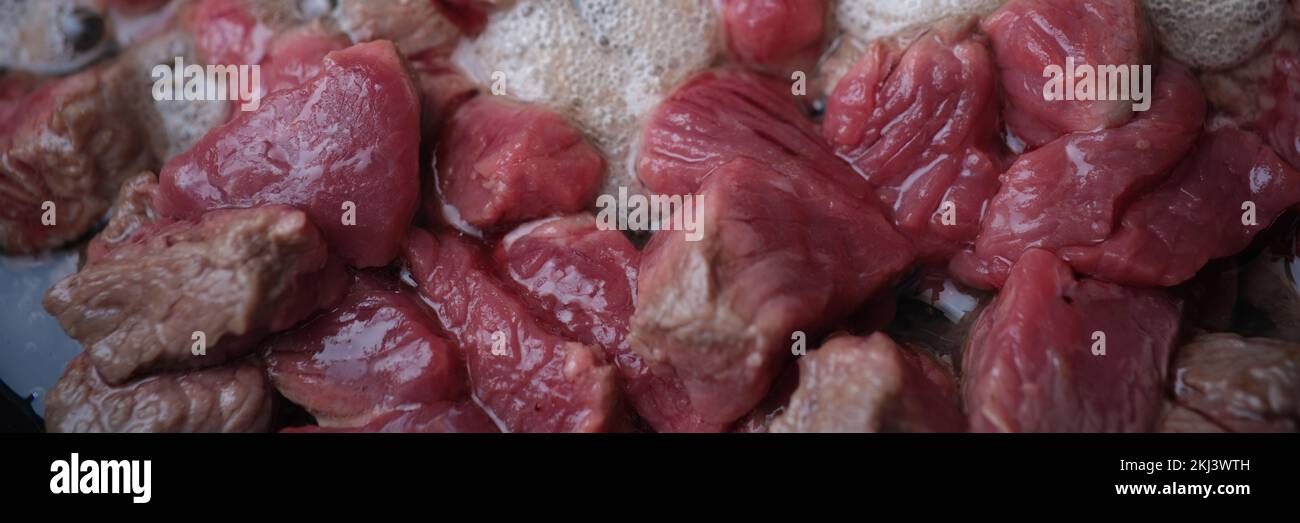 Pieces of pork beef lamb fried in frying pan Stock Photo Alamy