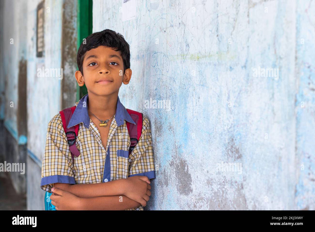 School boy with backpack standing front of camera Stock Photo - Alamy