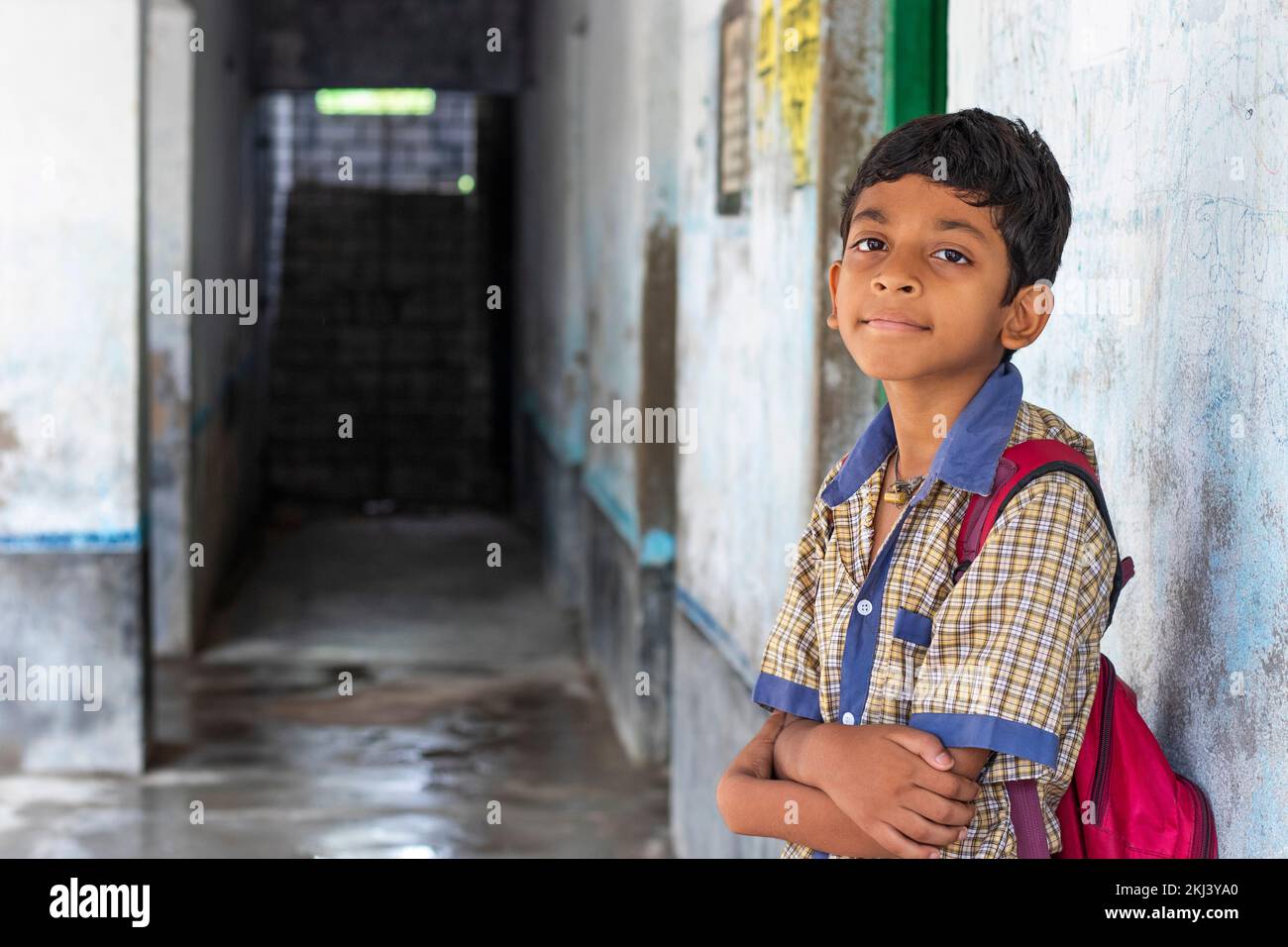 School boy with backpack standing front of camera Stock Photo - Alamy