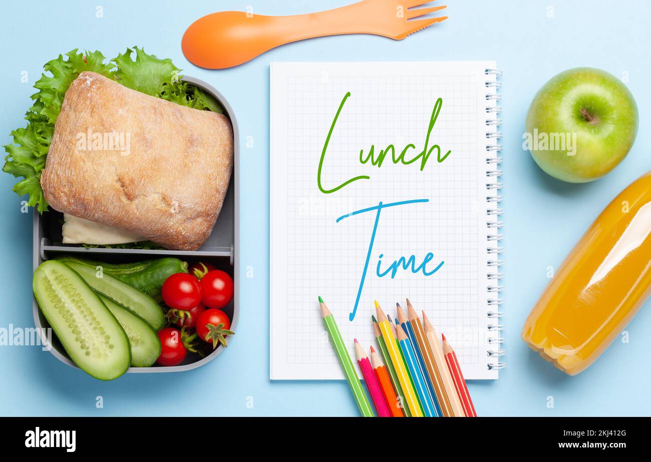 Lunch box with sandwich, vegetables and juice. School or office meal