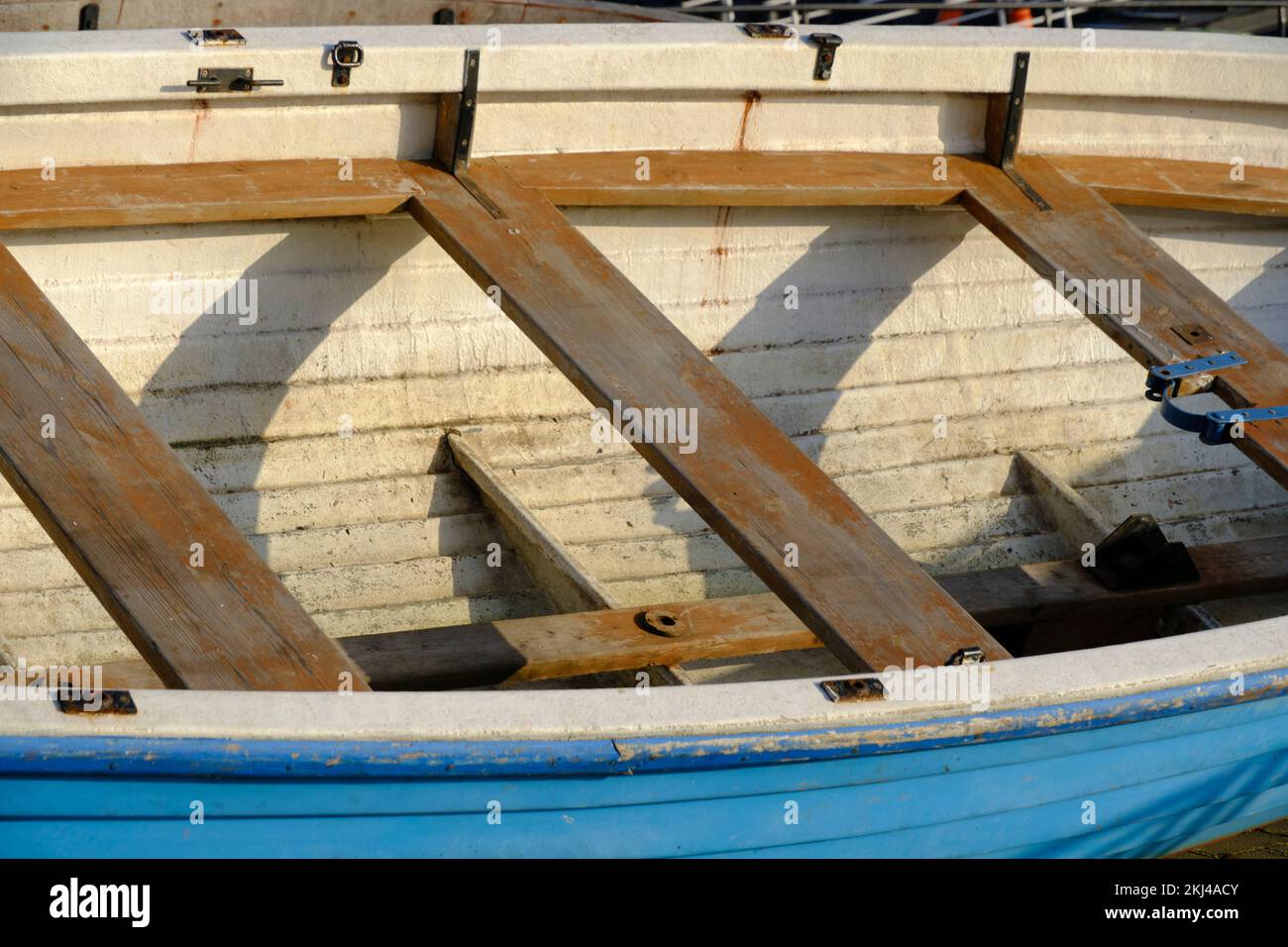 Old wooden boat lying shore Stock Photo - Alamy