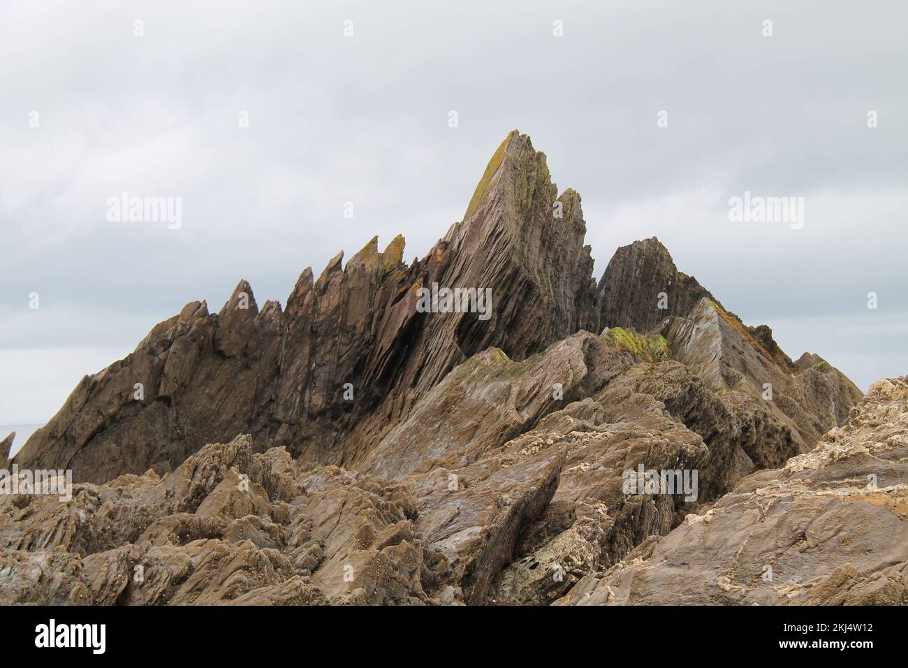 Dramatic Rock Formations on a Coastal Cliff. Stock Photo