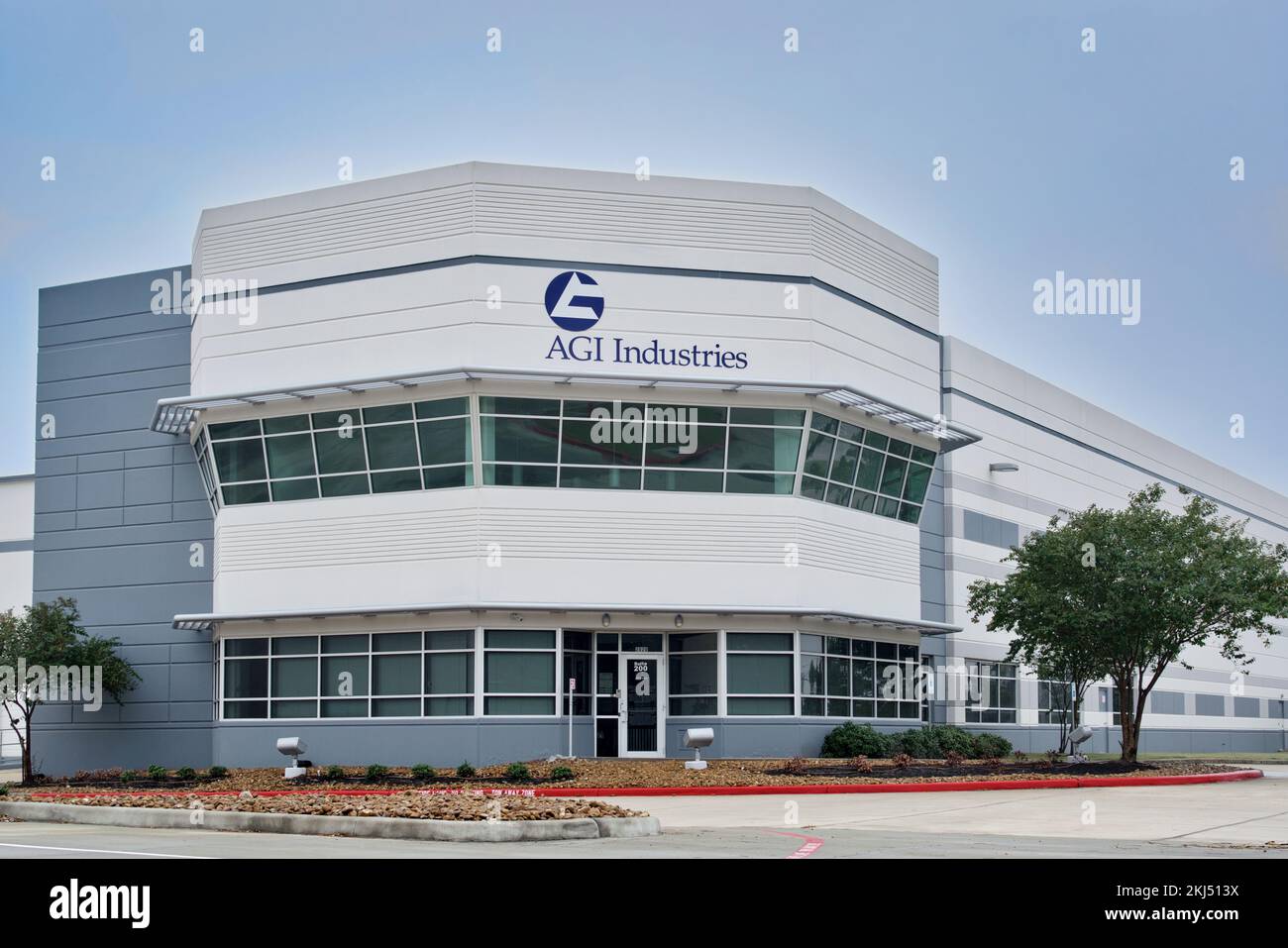 Houston, Texas USA 11-24-2022: AGI Industries office building exterior, corner view in Houston, TX. Industrial fluid handling products distributor. Stock Photo