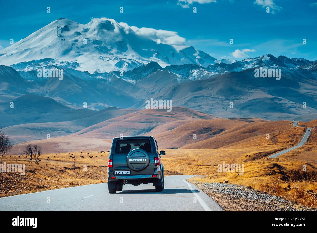 Elbrus Region, Russia. 2022, 26 October. Russian SUV UAZ Patriot or UAZ-3163. Extreme mountain safari. Sollers automotive group. Test-drive a new car in the mountains.  Stock Photo