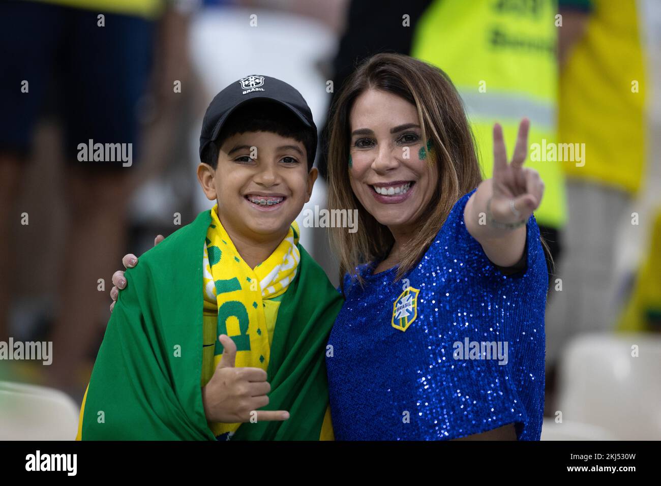 Lusail Iconic Stadium, Lusail, Qatar. 24th Nov, 2022. FIFA World Cup Football, Brazil versus Serbia; A young Brazil fan with his mother in Brazil shirts Credit: Action Plus Sports/Alamy Live News Stock Photo