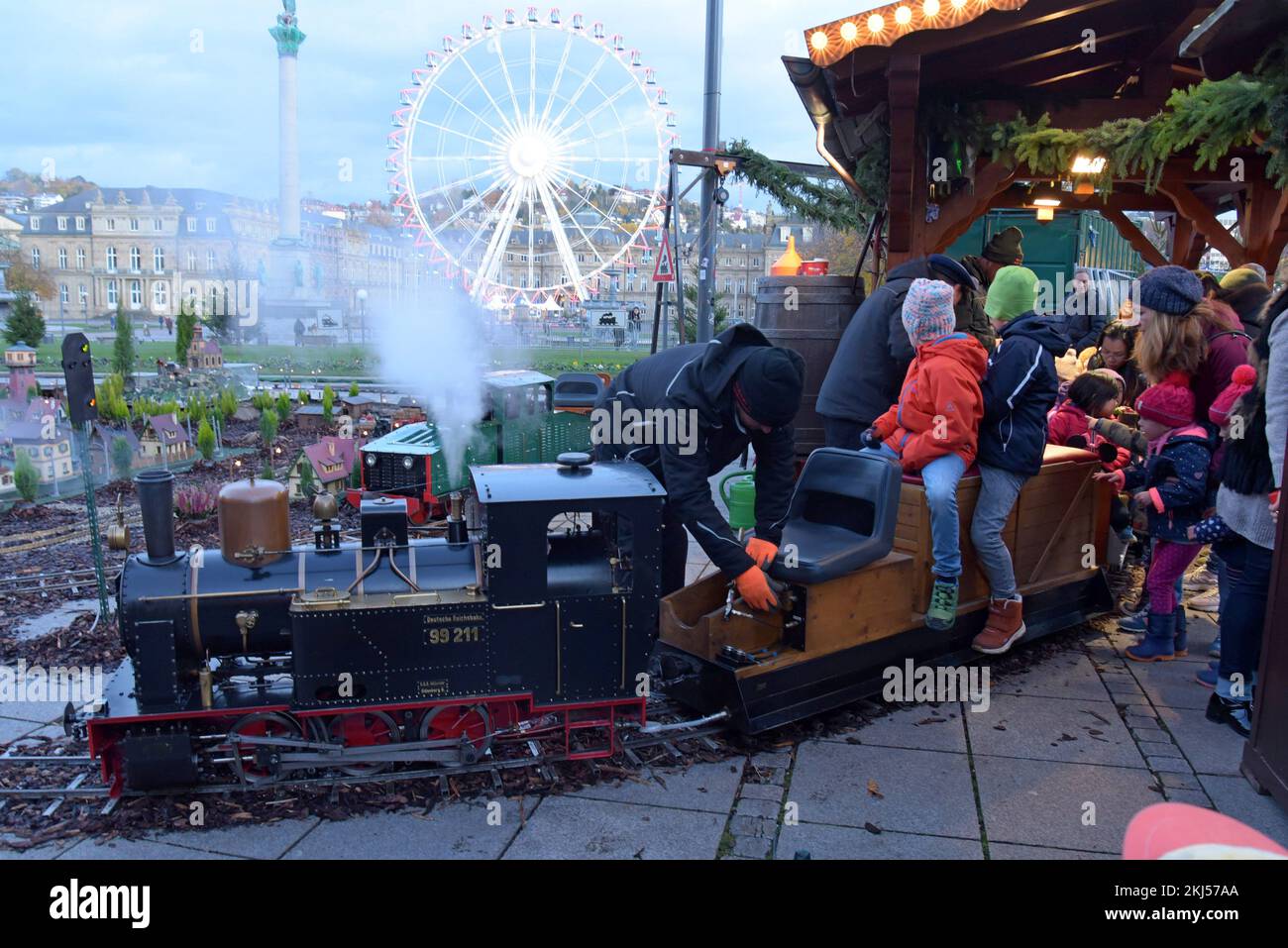 Stuttgart, Germany, 24th November 2022. An engineer fills the miniature steam locomotive with water at Stuttgart Christmas Market. The market, with 200 illuminated and decorated stalls, a fairground and miniature railway display is open every day until 23rd December. G.P.Essex/Alamy Live News Stock Photo