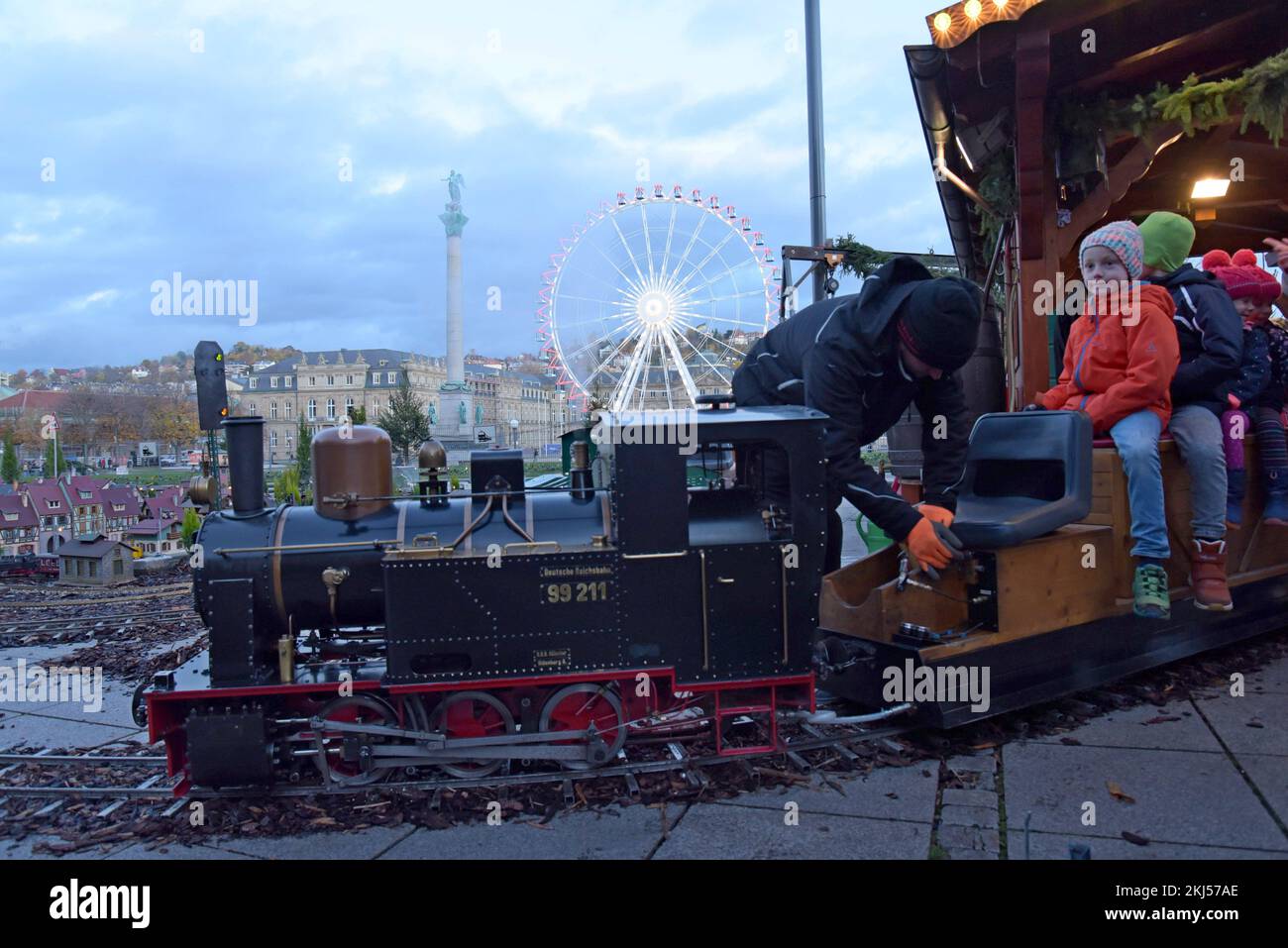 Stuttgart, Germany, 24th November 2022. An engineer fills the miniature steam locomotive with water at Stuttgart Christmas Market. The market, with 200 illuminated and decorated stalls, a fairground and miniature railway display is open every day until 23rd December. G.P.Essex/Alamy Live News Stock Photo