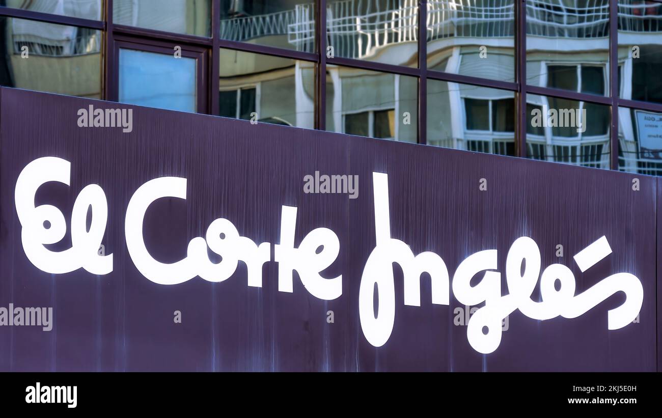 Alicante, Spain - September 12, 2022: A shop sign of the Spanish department store El Corte Ingles. The sign is written in white calligraphic lettering Stock Photo