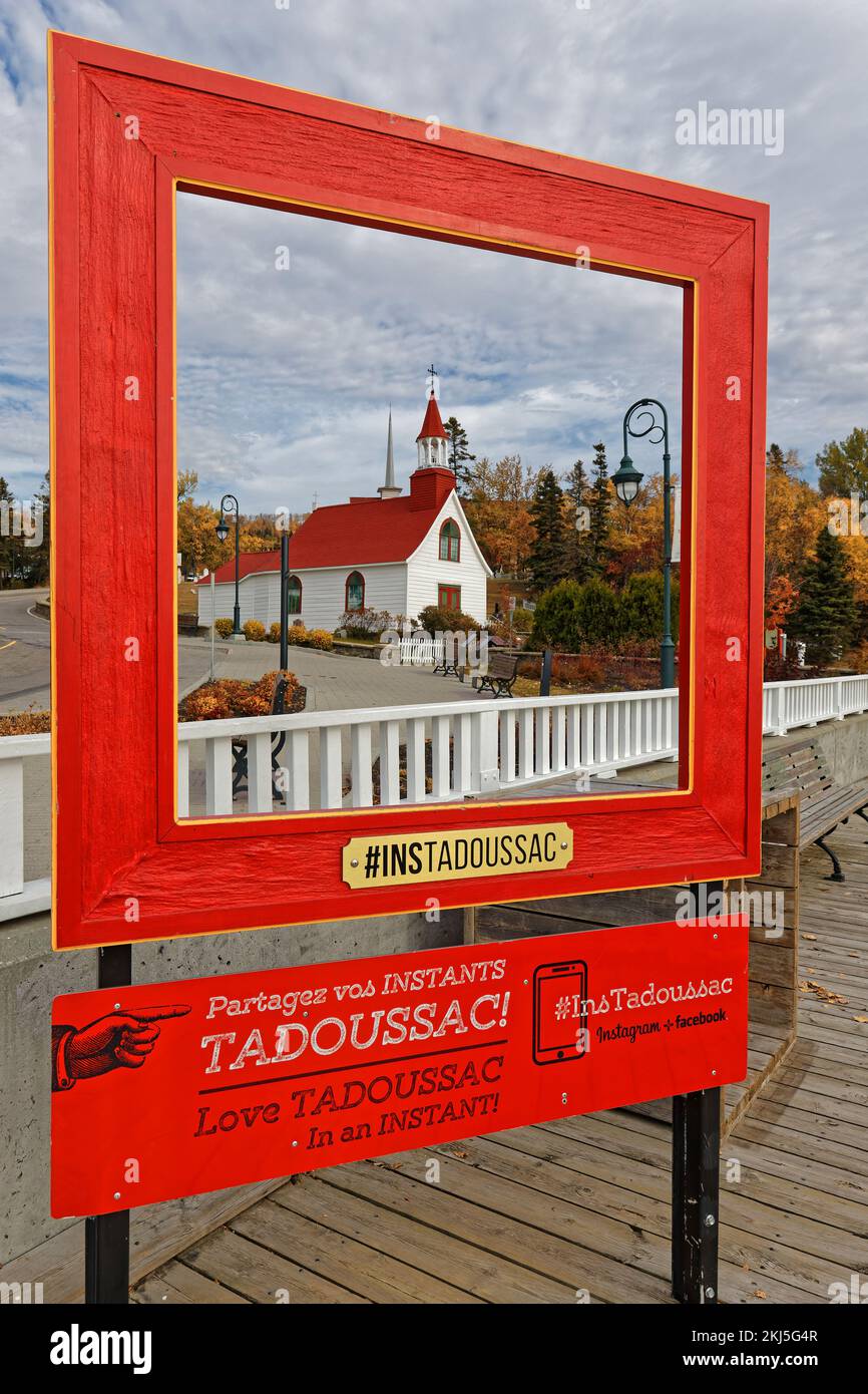 TADOUSSAC, QUEBEC, October 13, 2022 : Old indians chapel in a red frame proposed by tourism office of the municipality Stock Photo