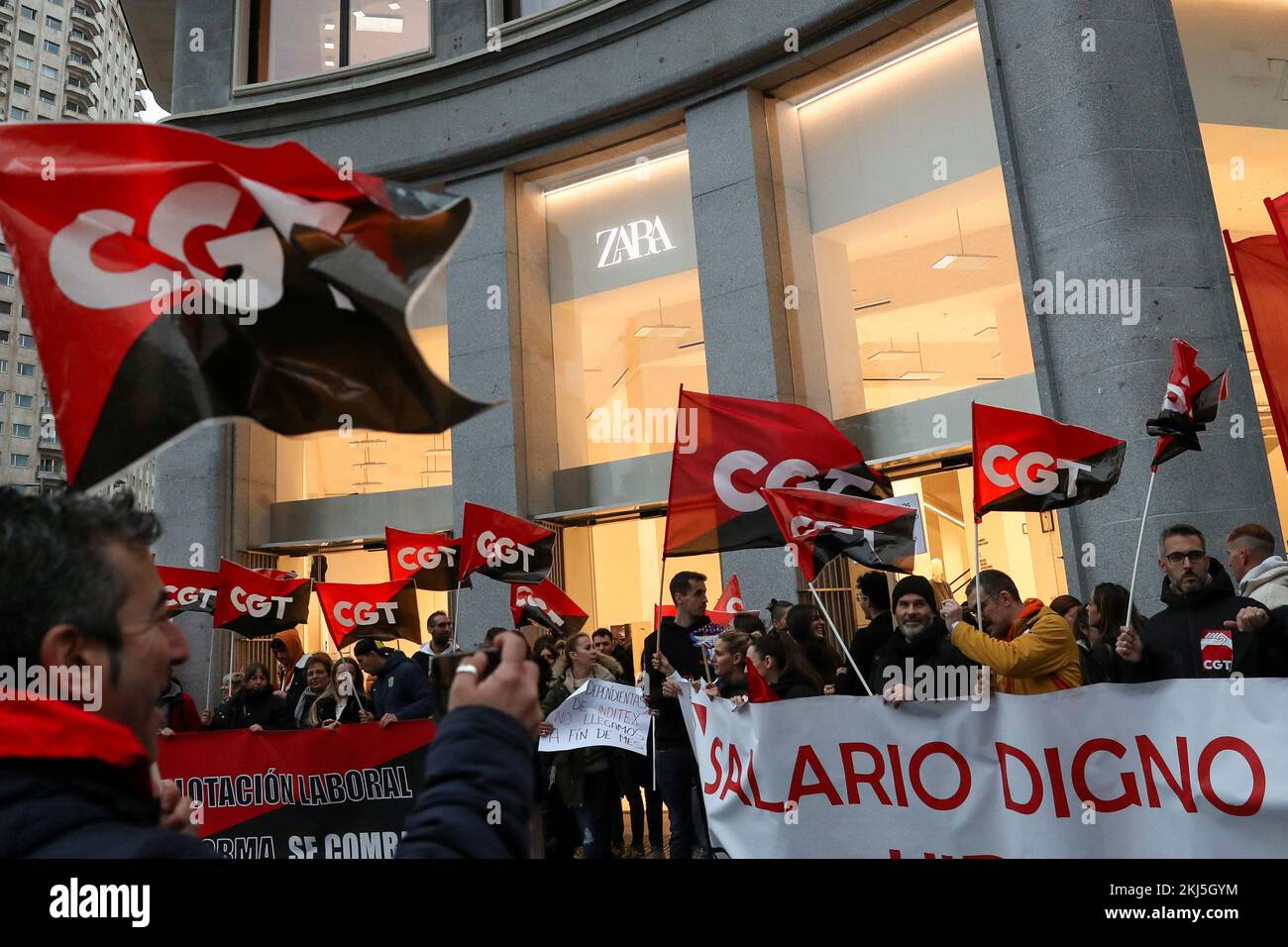 People hold flags from Spain's CGT labour union as they protest outside a  Zara clothing store, an Inditex brand, in Madrid, Spain, February 25, 2021.  REUTERS/Susana Vera Stock Photo - Alamy