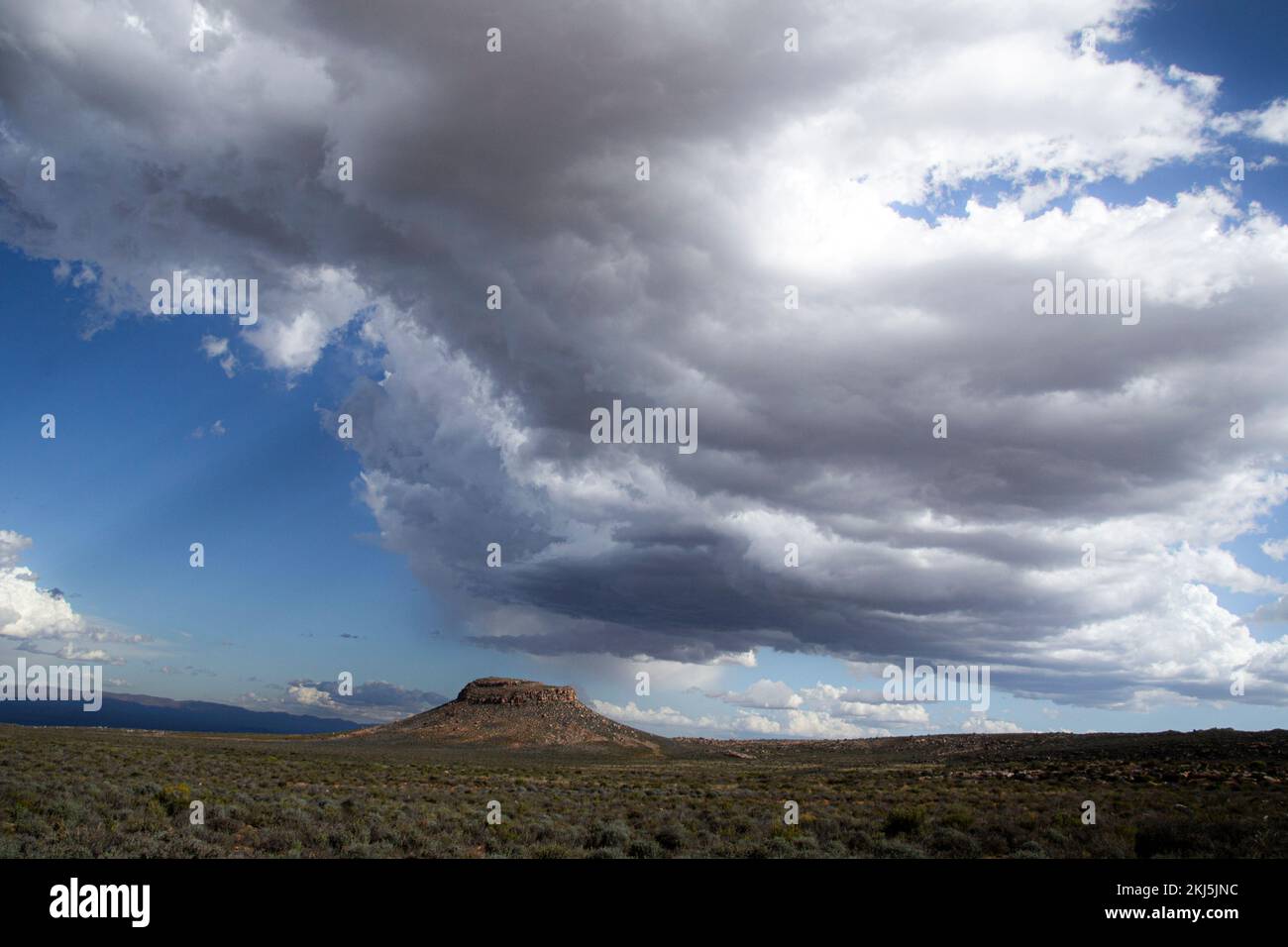 Storm clouds brewing over a hill in the Karoo Desert Stock Photo - Alamy