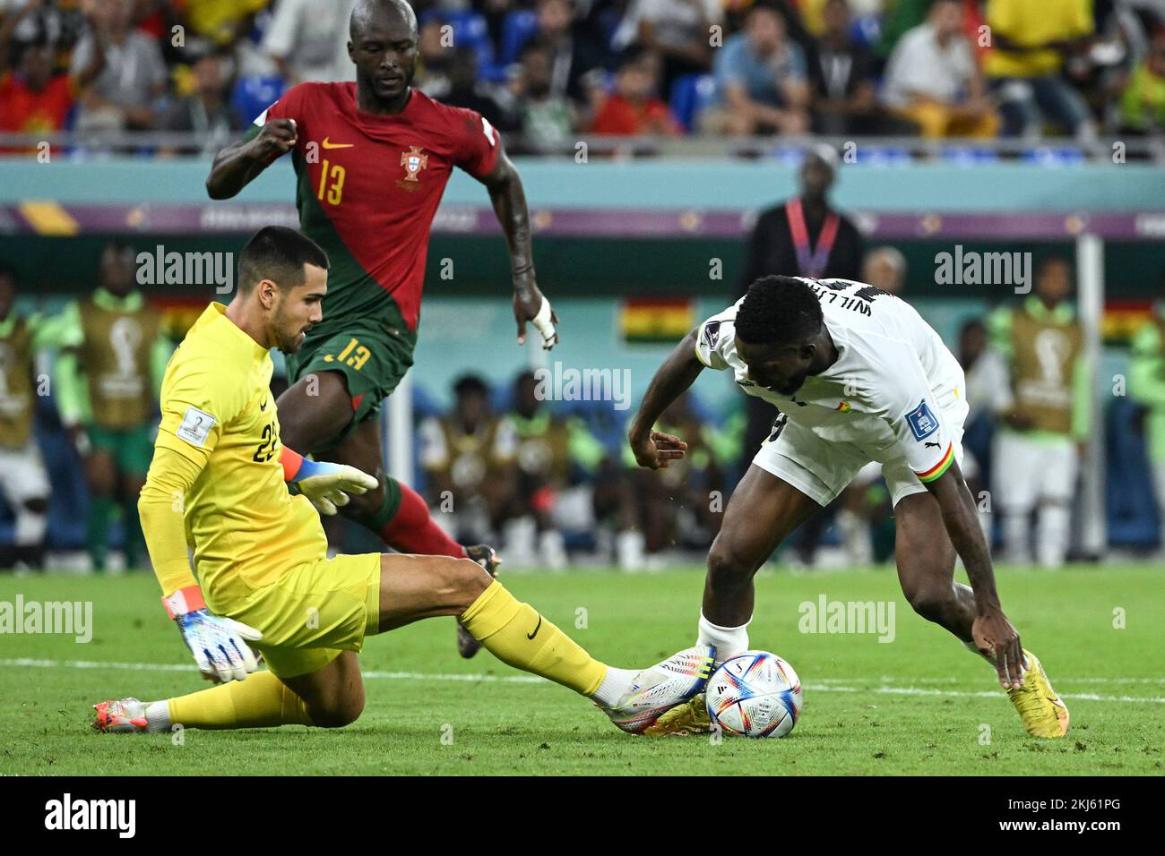 Doha, Qatar. 24th Nov, 2022. Diogo Costa (L), goalkeeper of Portugal, competes with Inaki Williams (R) of Ghana during the Group H match between Portugal and Ghana at the 2022 FIFA World Cup at Ras Abu Aboud (974) Stadium in Doha, Qatar, Nov. 24, 2022. Credit: Li Ga/Xinhua/Alamy Live News Stock Photo