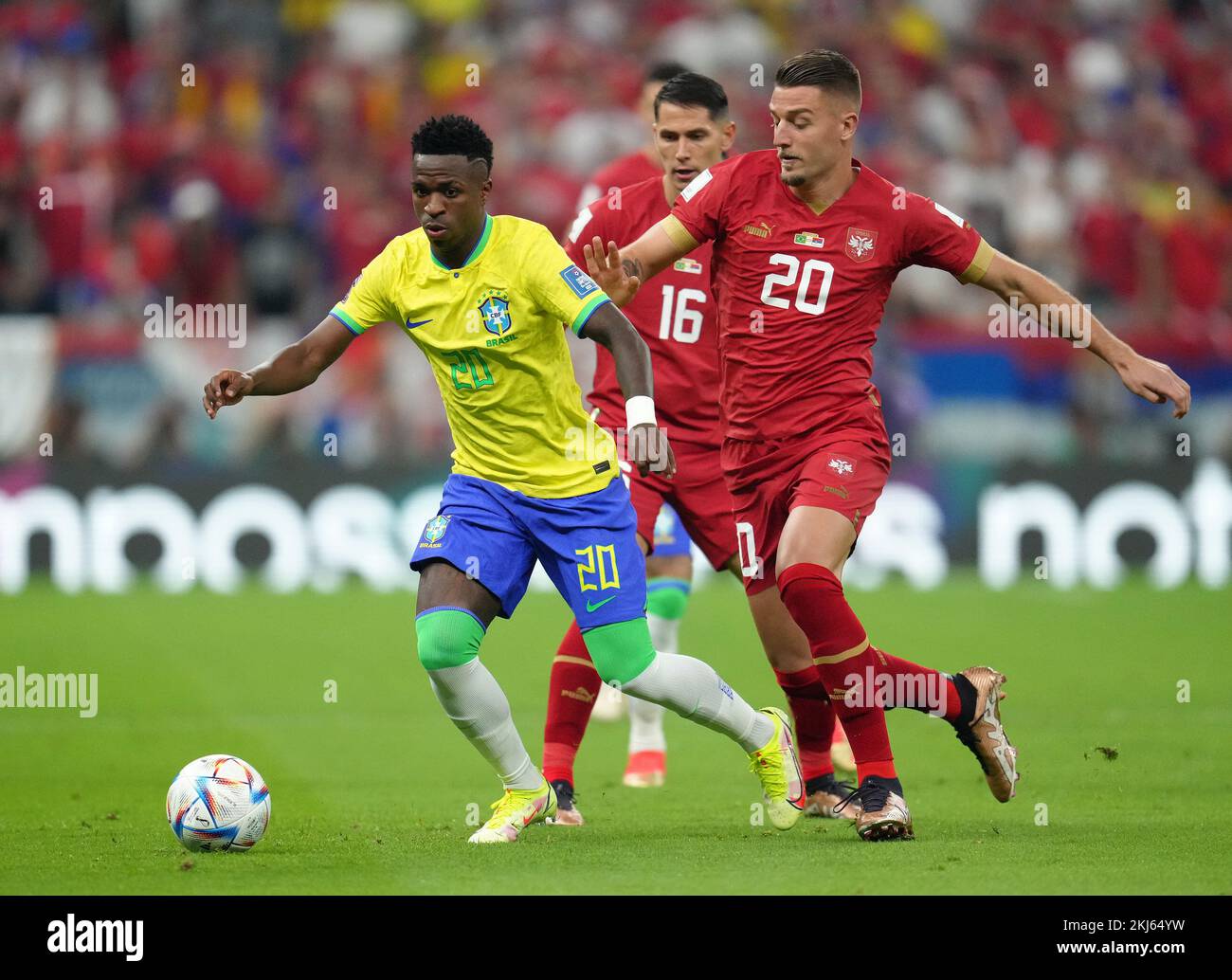 Brazil's Vinicius Junior (left) and Serbia's Sergej Milinkovic-Savic in action during the FIFA World Cup Group G match at the Lusail Stadium in Lusail, Qatar. Picture date: Thursday November 24, 2022. Stock Photo