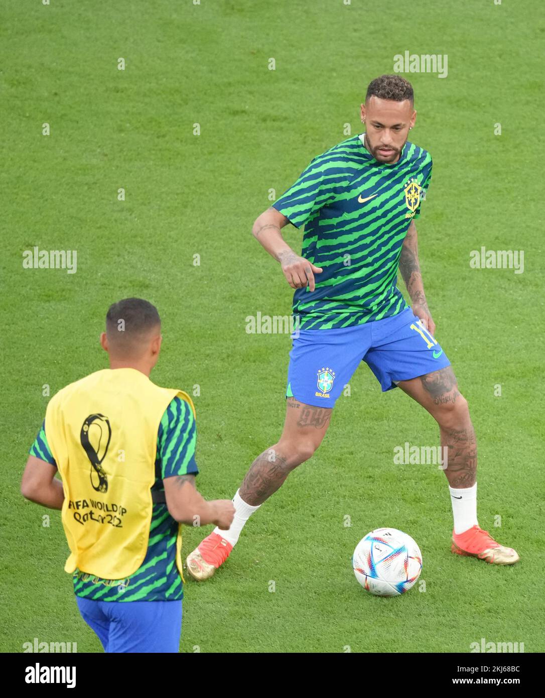 Lusail, Qatar. 24th Nov, 2022. Neymar (R) of Brazil warms up before the Group G match between Brazil and Serbia at the 2022 FIFA World Cup at Lusail Stadium in Lusail, Qatar, Nov. 24, 2022. Credit: Ding Xu/Xinhua/Alamy Live News Stock Photo