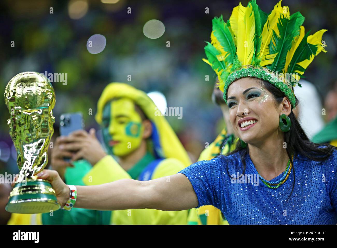 Lusail Iconic Stadium, Lusail, Qatar. 24th Nov, 2022. FIFA World Cup Football, Brazil versus Serbia; Fans of Brasil with a replica cup trophy Credit: Action Plus Sports/Alamy Live News Stock Photo