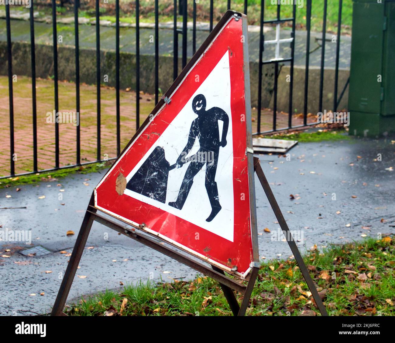 funny men at work road sign Stock Photo