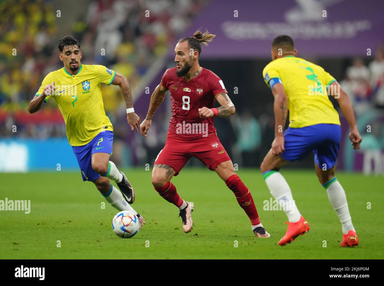 Serbia's Nemanja Gudelj (centre) in action with Brazil's Lucas Paqueta (left) and Thiago Silva during the FIFA World Cup Group G match at the Lusail Stadium in Lusail, Qatar. Picture date: Thursday November 24, 2022. Stock Photo