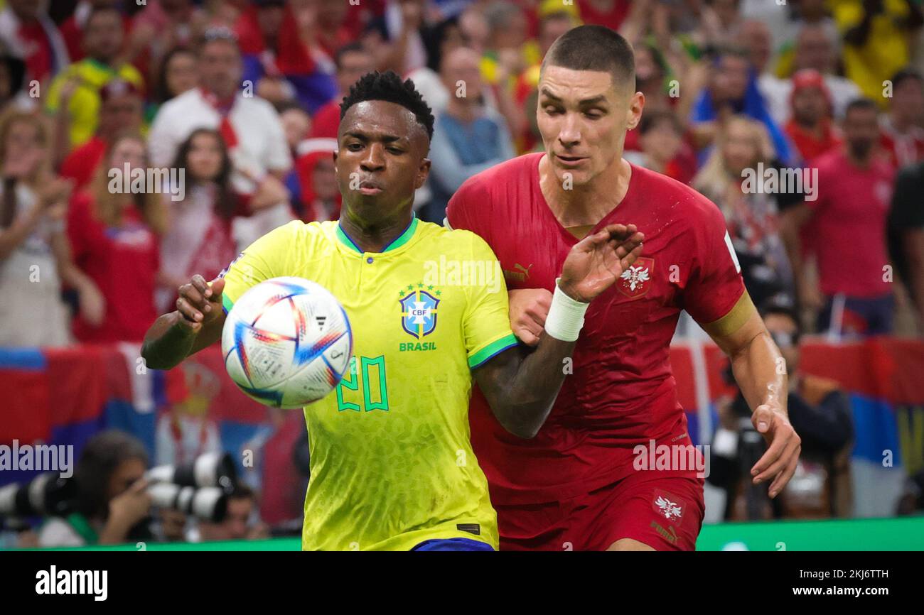 Brazilian Vinicius Junior and Serbian Nikola Milenkovic fight for the ball during a soccer game between Brazil and Serbia, in Group G of the FIFA 2022 World Cup in Lusail, State of Qatar on Thursday 24 November 2022. BELGA PHOTO VIRGINIE LEFOUR Credit: Belga News Agency/Alamy Live News Stock Photo