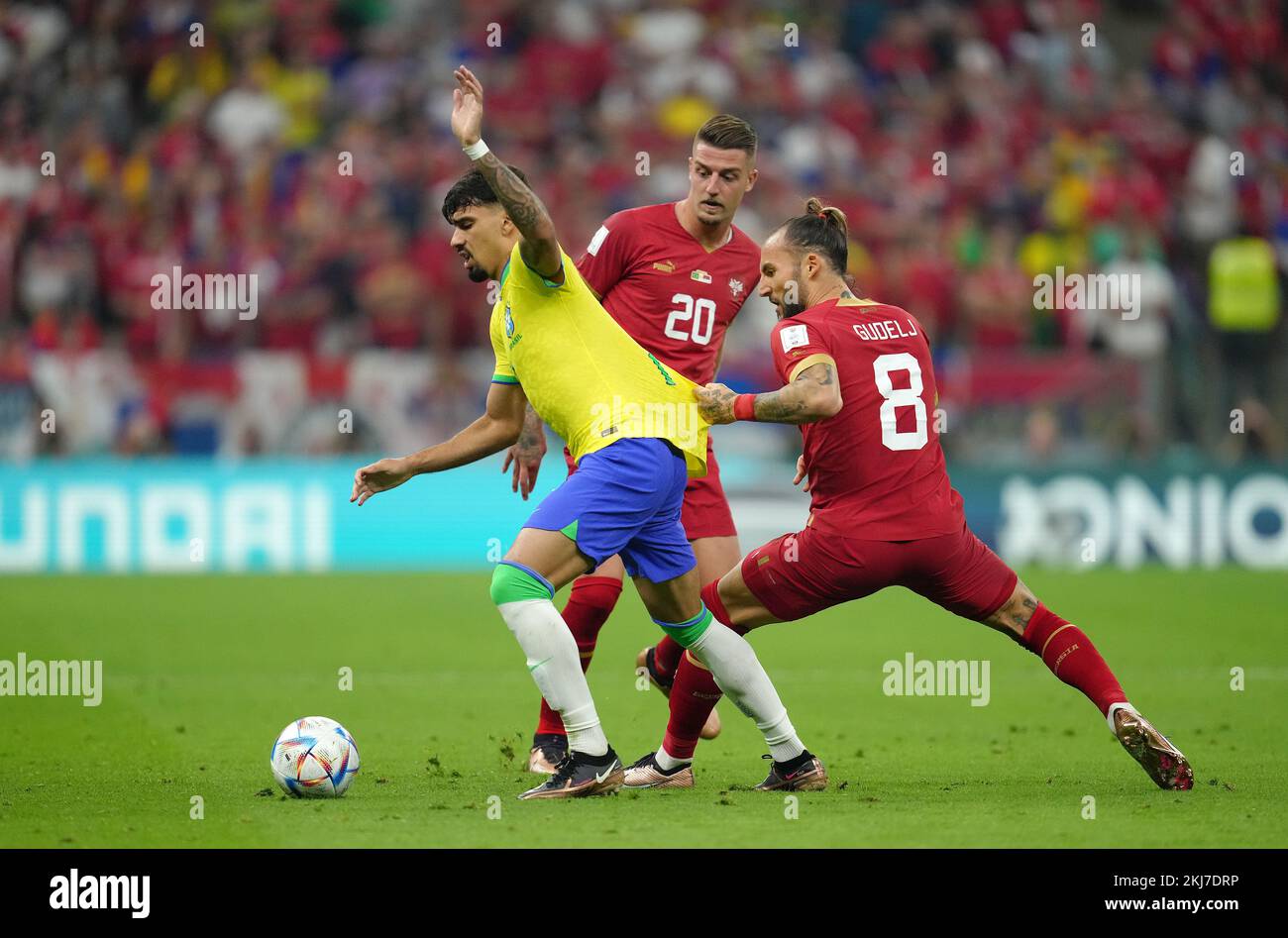 Brazil's Lucas Paqueta (left) and Serbia's Nemanja Gudelj battle for the ball during the FIFA World Cup Group G match at the Lusail Stadium in Lusail, Qatar. Picture date: Thursday November 24, 2022. Stock Photo