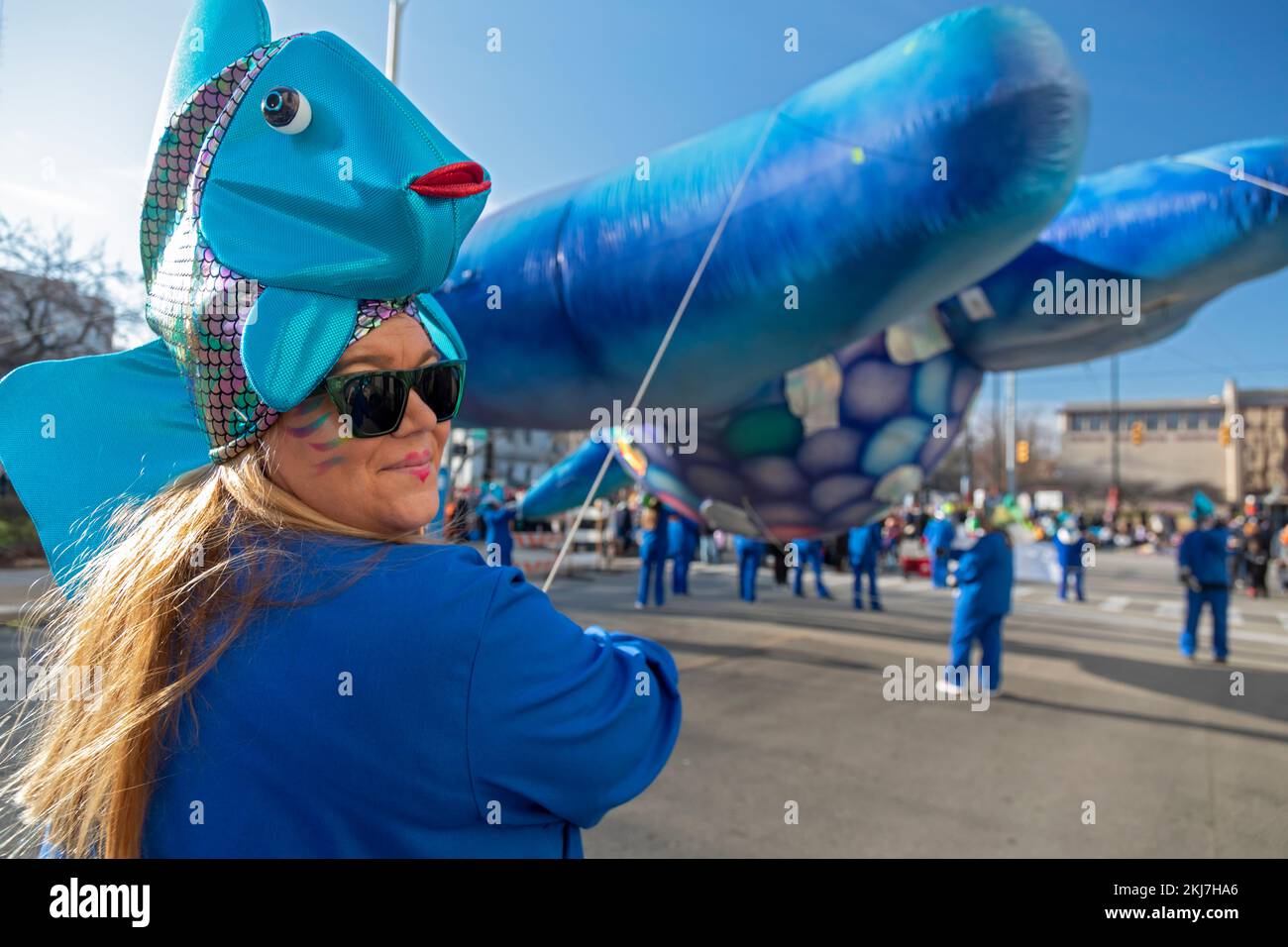 Detroit, Michigan, USA. 24th Nov, 2022. A balloon handler in a fish costume at Detroit's Thanksgiving Day parade, officially America's Thanksgiving Parade. Credit: Jim West/Alamy Live News Stock Photo