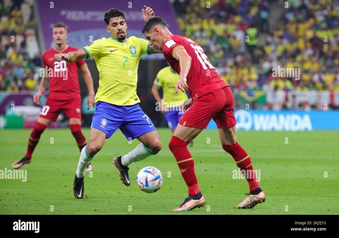 Brazilian Lucas Paqueta and Serbian Sasa Lukic fight for the ball during a soccer game between Brazil and Serbia, in Group G of the FIFA 2022 World Cup in Lusail, State of Qatar on Thursday 24 November 2022. BELGA PHOTO VIRGINIE LEFOUR Credit: Belga News Agency/Alamy Live News Stock Photo