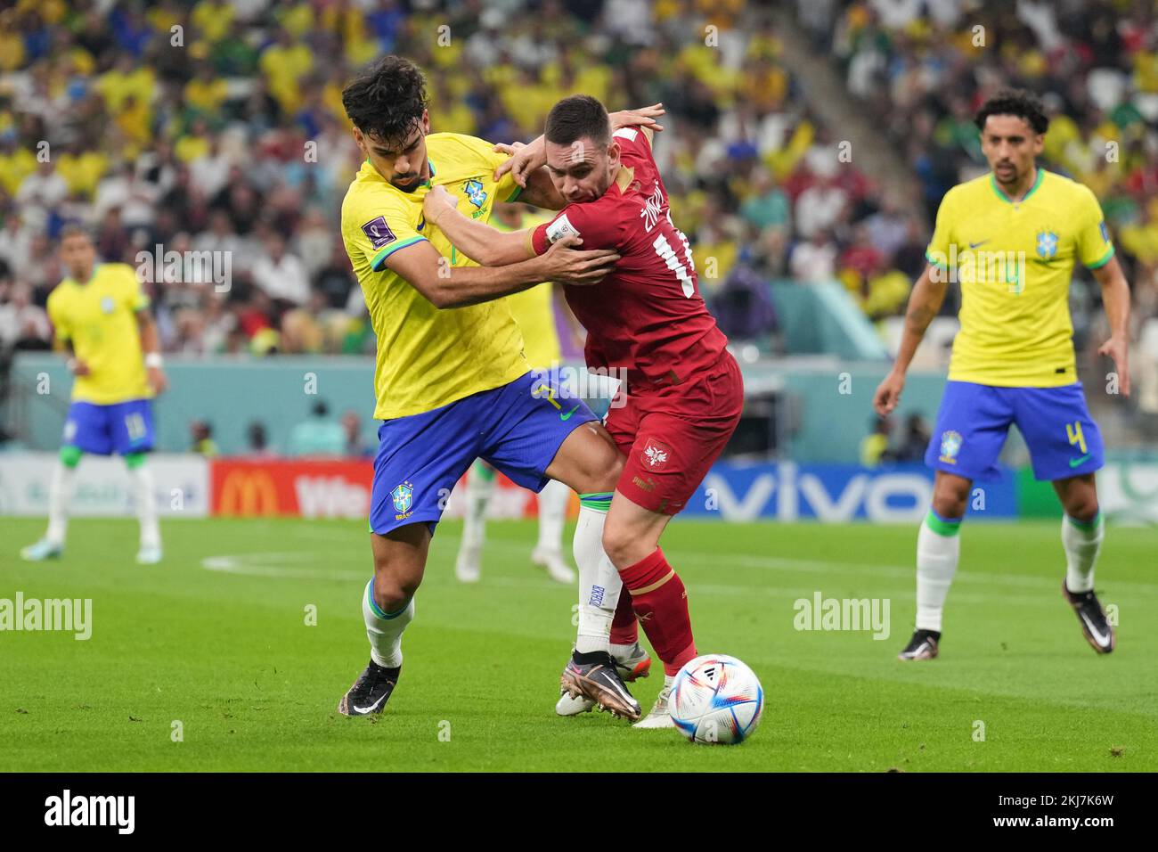 Brazil’s Lucas Paqueta (left) and Serbia’s Andrija Zivkovic battle for the ball during the FIFA World Cup Group G match at the Lusail Stadium in Lusail, Qatar. Picture date: Thursday November 24, 2022. Stock Photo
