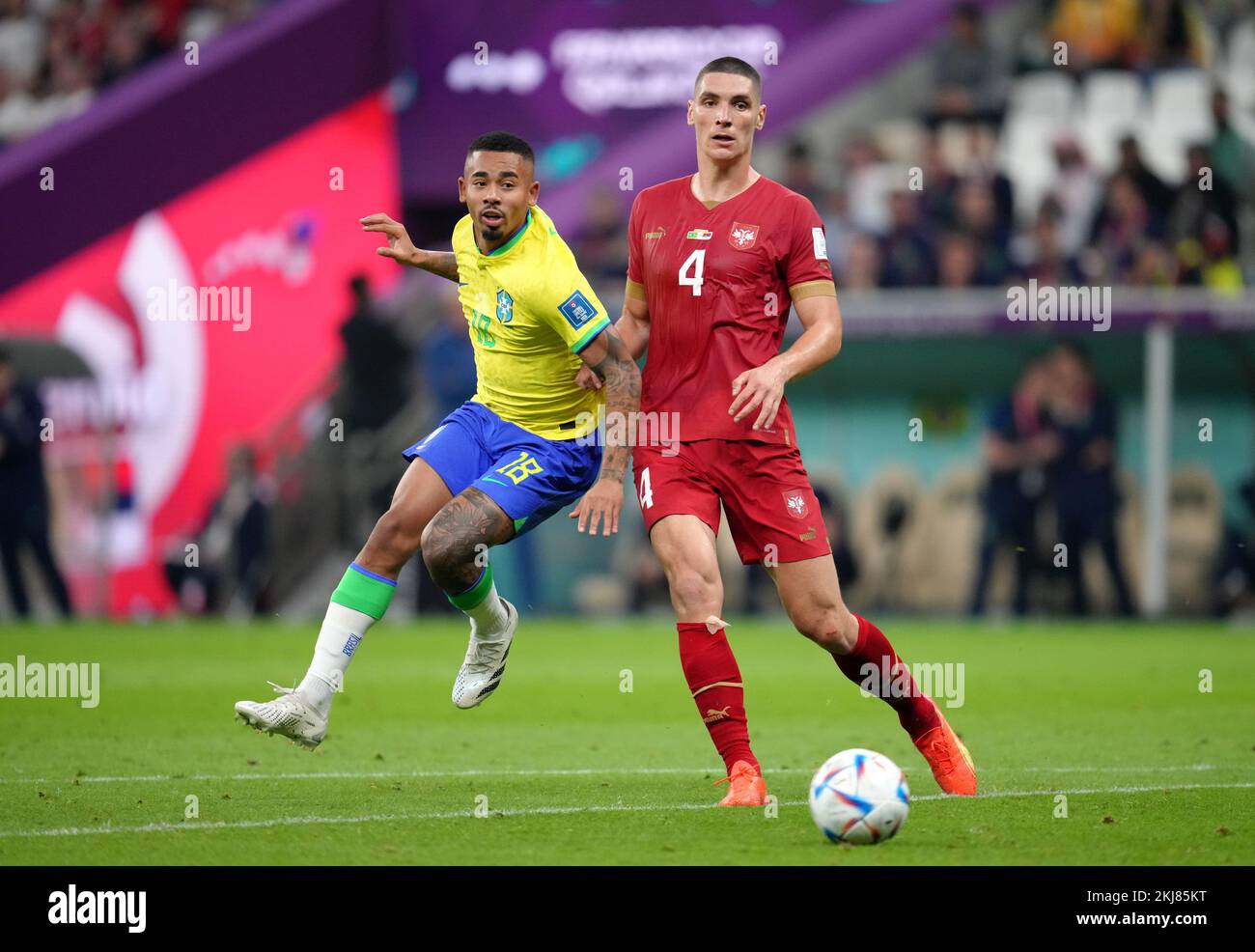 Brazil's Gabriel Jesus (left) and Serbia's Nikola Milenkovic in action during the FIFA World Cup Group G match at the Lusail Stadium in Lusail, Qatar. Picture date: Thursday November 24, 2022. Stock Photo