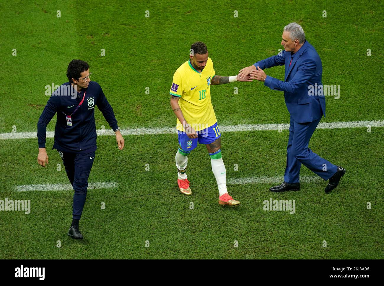 Brazil manager Tite consoles Brazil’s Neymar after being subtituted during the FIFA World Cup Group G match at the Lusail Stadium, Lusail, Qatar. Picture date: Thursday November 24, 2022. Stock Photo