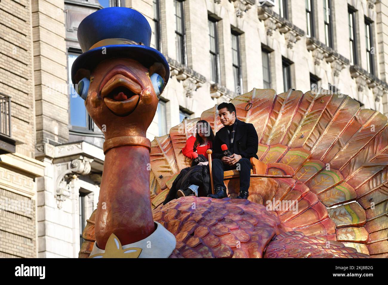 Tv personality mario lopez r sits atop the tom turkey float leading