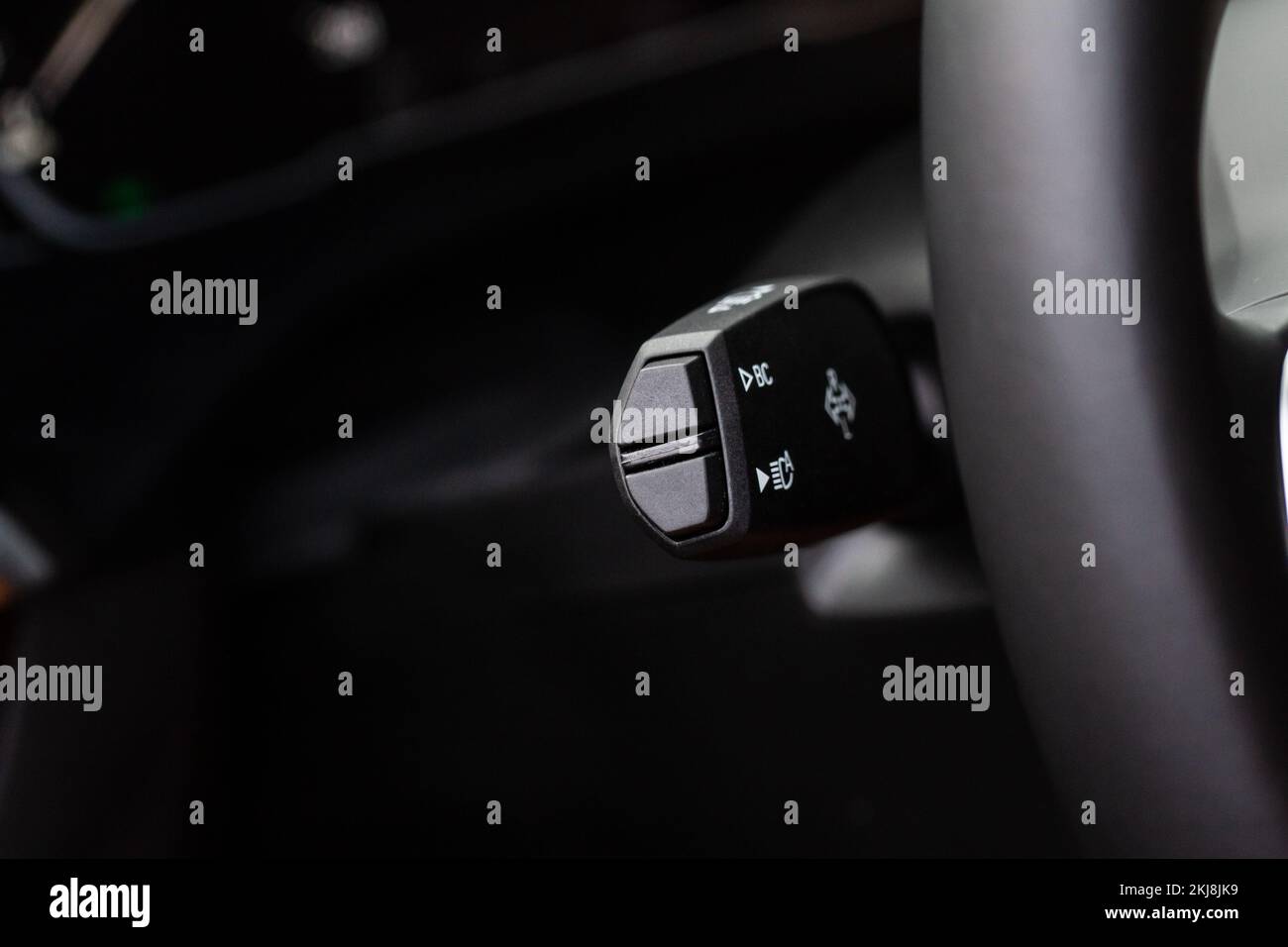 Turn signal lever close up. Modern car interior details. Car wipers