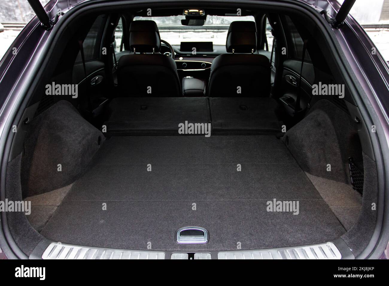 Huge, clean and empty car trunk in interior of compact suv. Rear view of a SUV car with open trunk Stock Photo