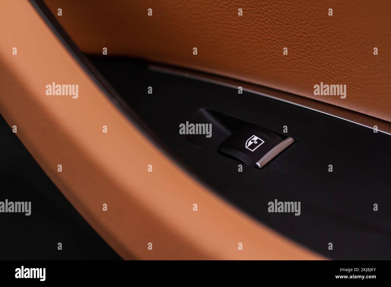 Close up view of button controlling window in modern car interior