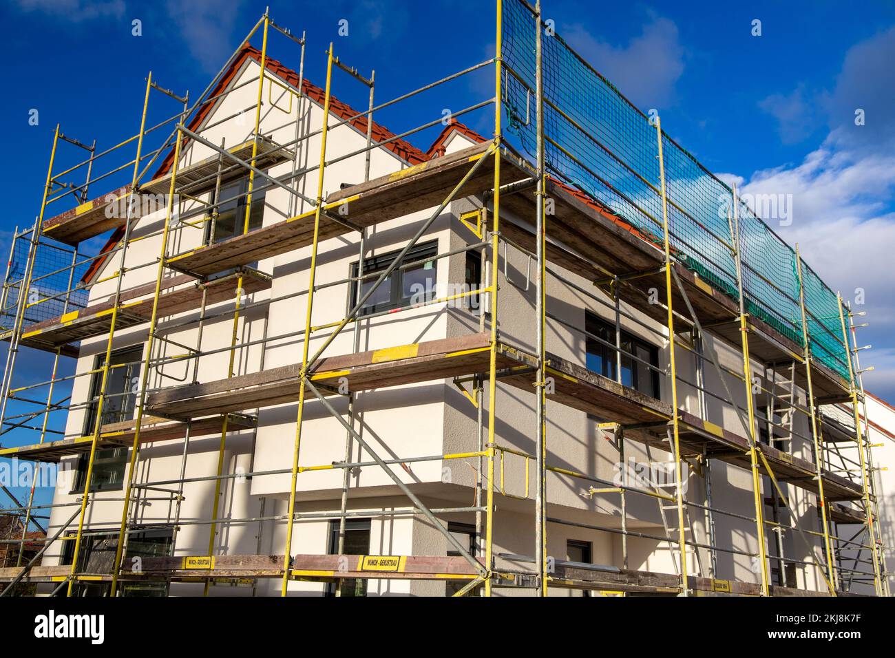 Scaffolding on a newly built detached house Stock Photo