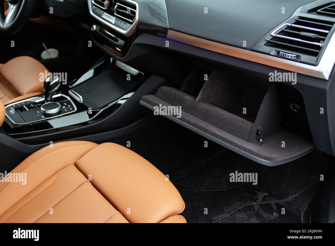 Opened car glove box compartment. Glove compartment of car Stock Photo