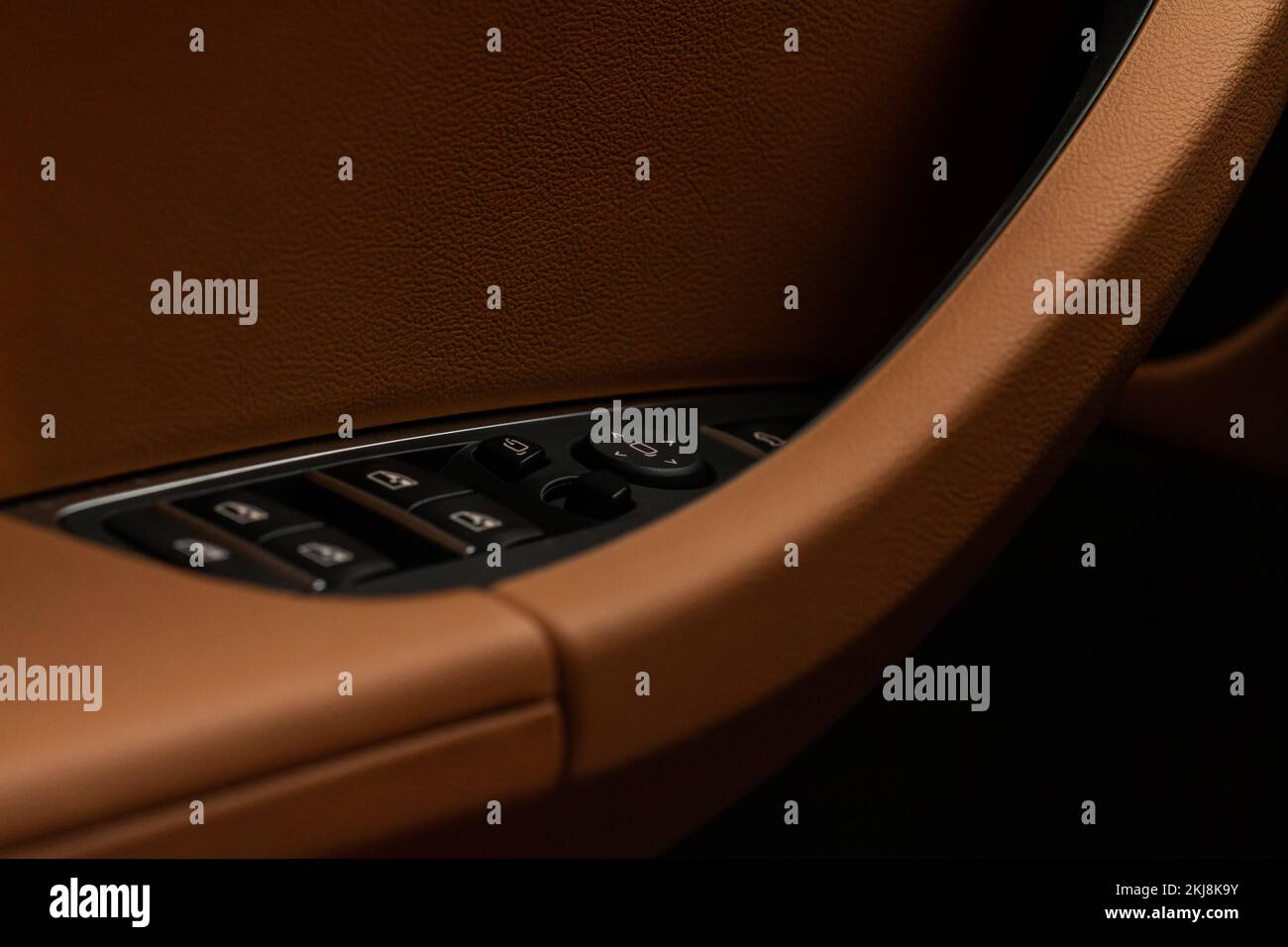 Close up view of button controlling window in modern car interior