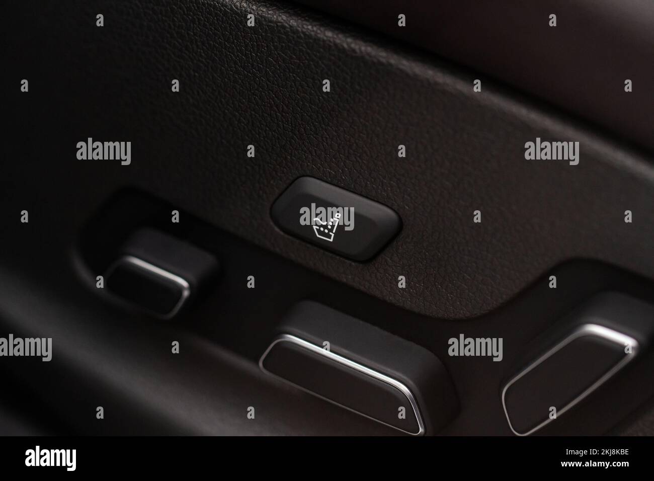 Electric car seat adjustment control panel close up view. Adjustable