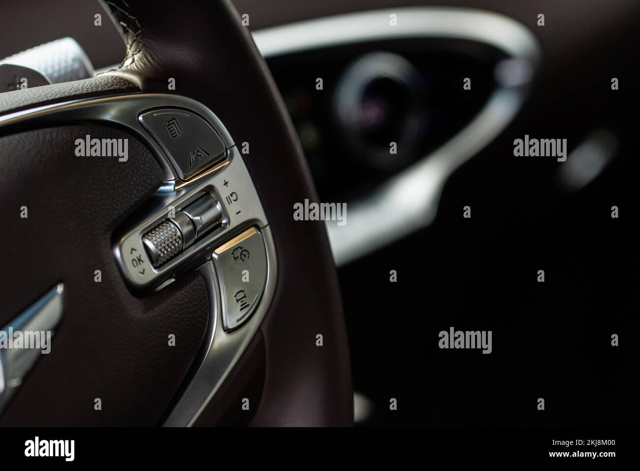 Cruise control switch closeup. Adaptive cruise control leaver. Cruise control on steering wheel. Stock Photo