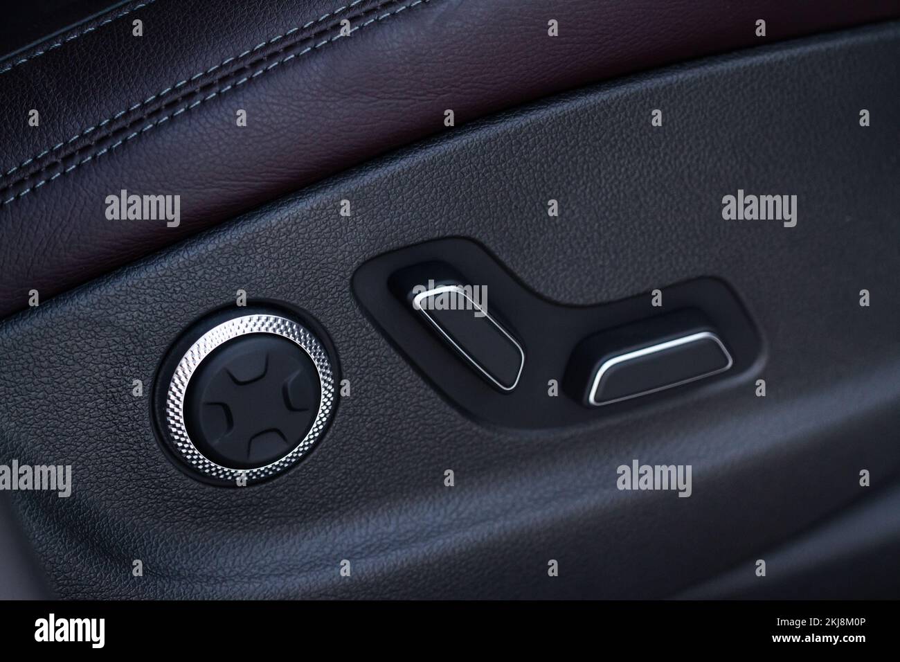 Electric car seat adjustment control panel close up view. Adjustable car seat position. Car