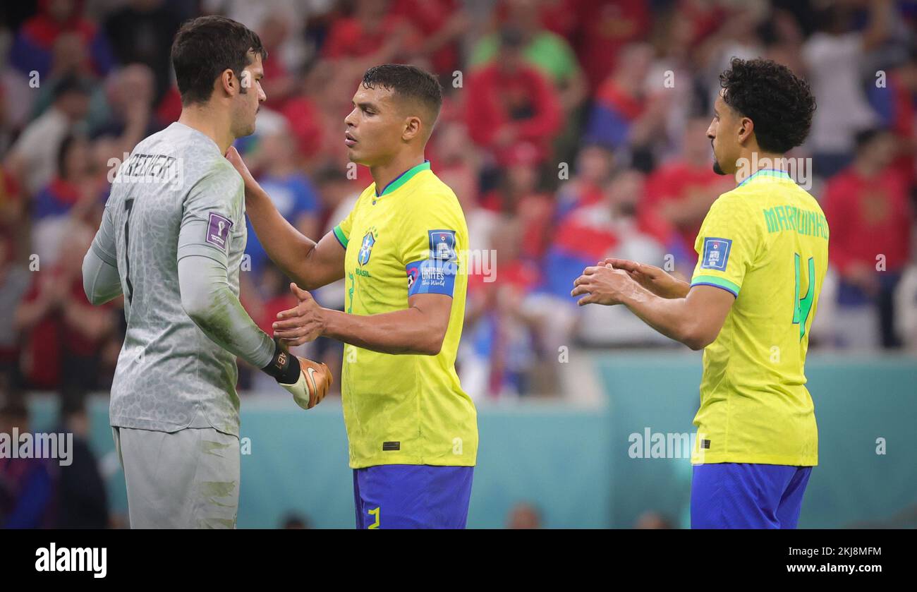 Brazilian goalkeeper Alisson, Brazilian Thiago Silva and Brazilian Marquinhos celebrate after winning a soccer game between Brazil and Serbia, in Group G of the FIFA 2022 World Cup in Lusail, State of Qatar on Thursday 24 November 2022. BELGA PHOTO VIRGINIE LEFOUR Credit: Belga News Agency/Alamy Live News Stock Photo
