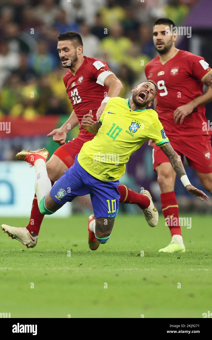 Lusail, Qatar. 24th Nov, 2022. Neymar (Front) of Brazil falls down during the Group G match between Brazil and Serbia at the 2022 FIFA World Cup at Lusail Stadium in Lusail, Qatar, Nov. 24, 2022. Credit: Lan Hongguang/Xinhua/Alamy Live News Stock Photo