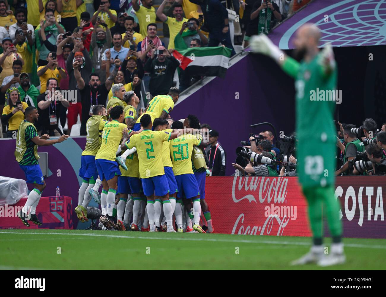 Lusail, Qatar. 24th Nov, 2022. Soccer: World Cup, Brazil - Serbia, Preliminary Round, Group G, Matchday 1, Lusail Iconic Stadium, Brazil's players cheer for the 2:0. In the foreground on the right, goalkeeper Ederson of Brazil spreads his arms in jubilation. Credit: Robert Michael/dpa/Alamy Live News Stock Photo