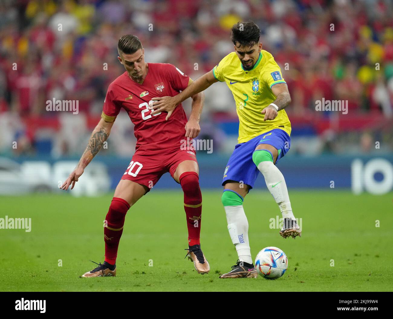 Serbia's Sergej Milinkovic-Savic (left) and Brazil's Lucas Paqueta battle for the ball during the FIFA World Cup Group G match at the Lusail Stadium in Lusail, Qatar. Picture date: Thursday November 24, 2022. Stock Photo