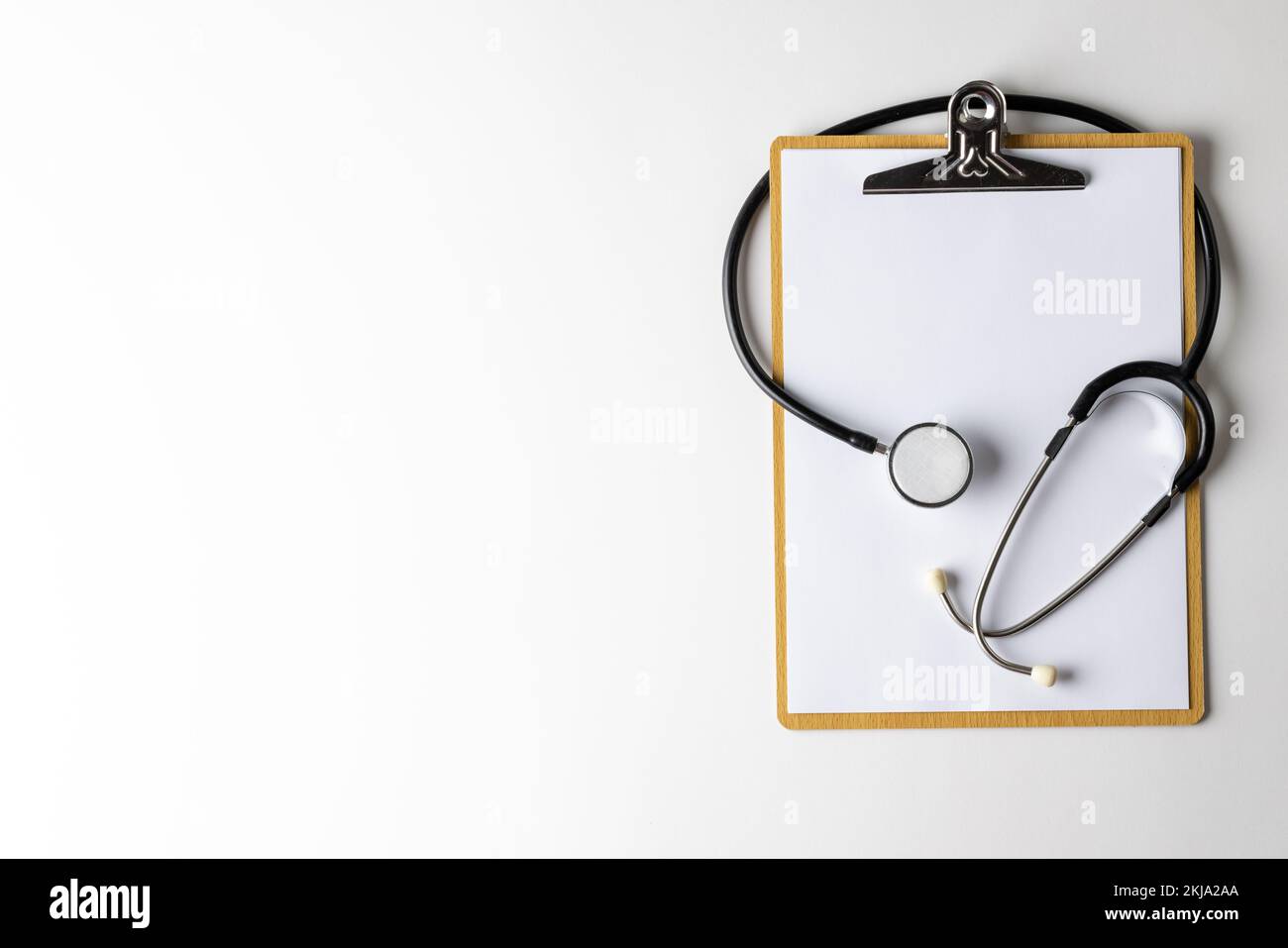 Composition of stethoscope with clipboard on white background with copy ...